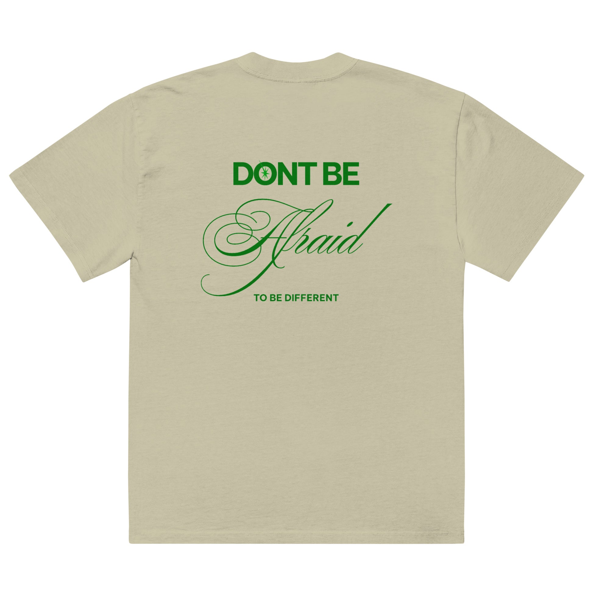 Back of Fearless Shirt in light tak color with green graphics stating "Don't be afraid to be different"